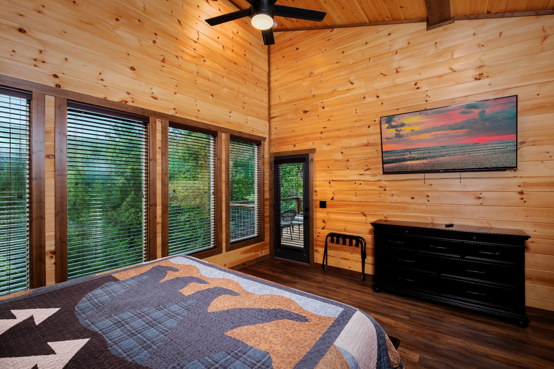 Primary Suite with TV & Treetop Views